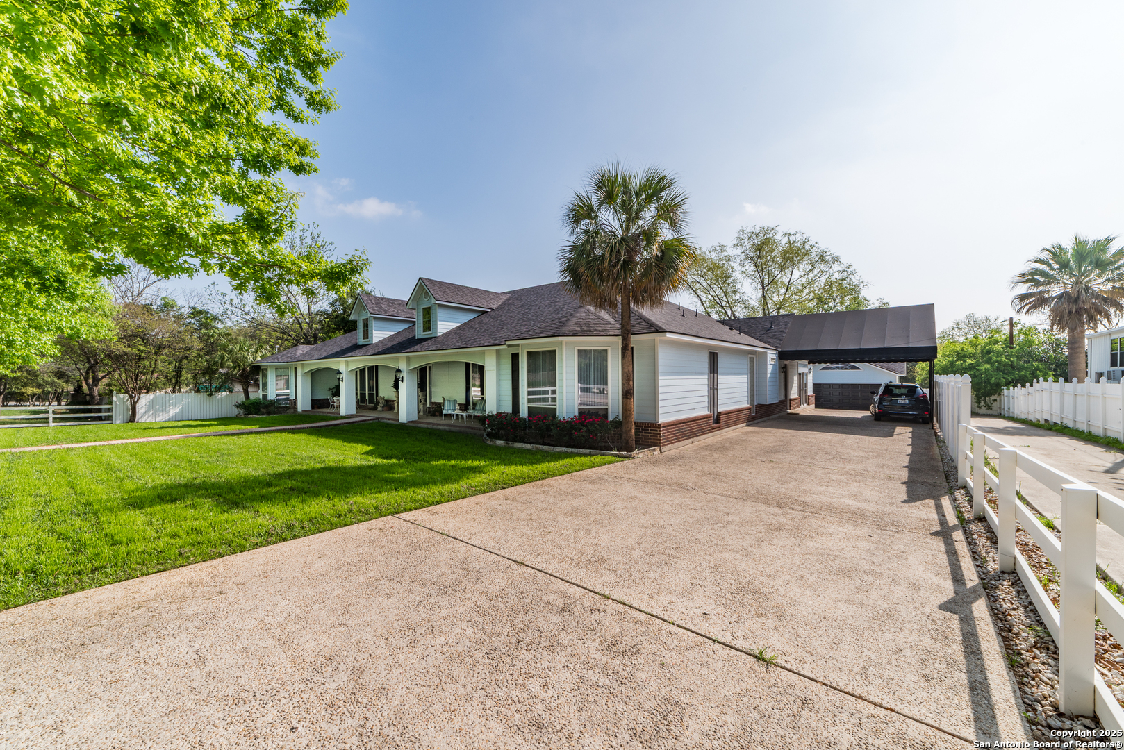 7226 North Vandiver Road San Antonio, TX 78209 - Photo 7 of 59 a front view of a house with a yard and trees