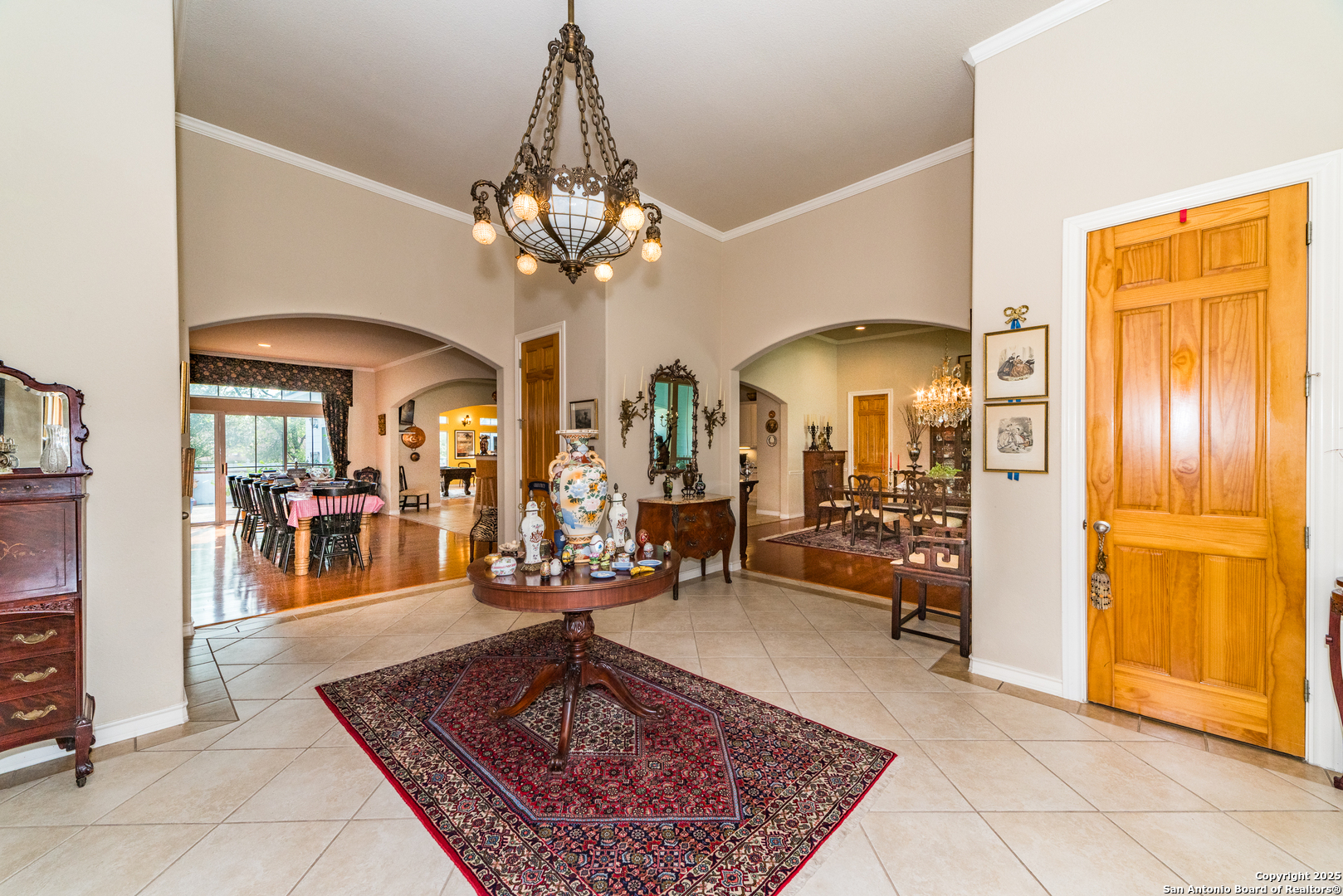 7226 North Vandiver Road San Antonio, TX 78209 - Photo 8 of 59 a living room with chandelier a table and a chandelier