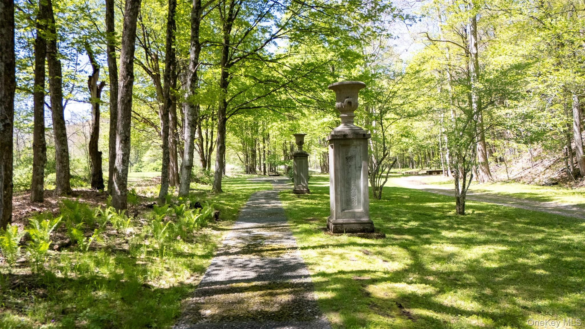 390 Erpf Road Arkville, NY 12406 - Photo 13 of 50 Wooded pathway, With giant urns, leading to a second Pagan Maze