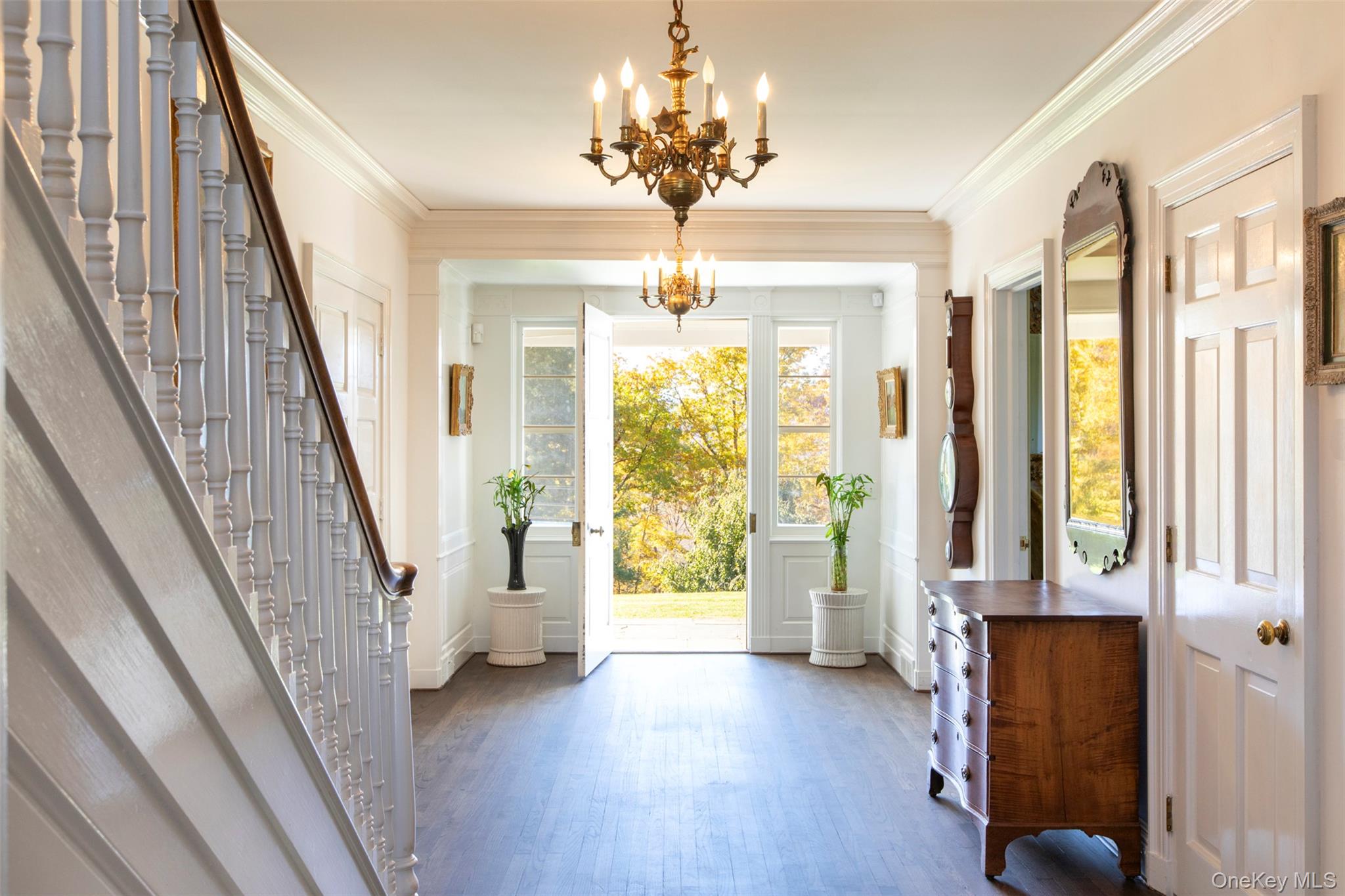 390 Erpf Road Arkville, NY 12406 - Photo 17 of 50 Foyer entrance featuring a chandelier, wood finished floors, stairs, crown molding, and baseboards