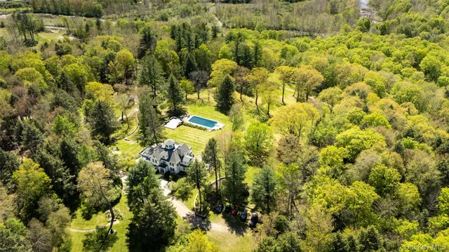a front view of a house with a big yard