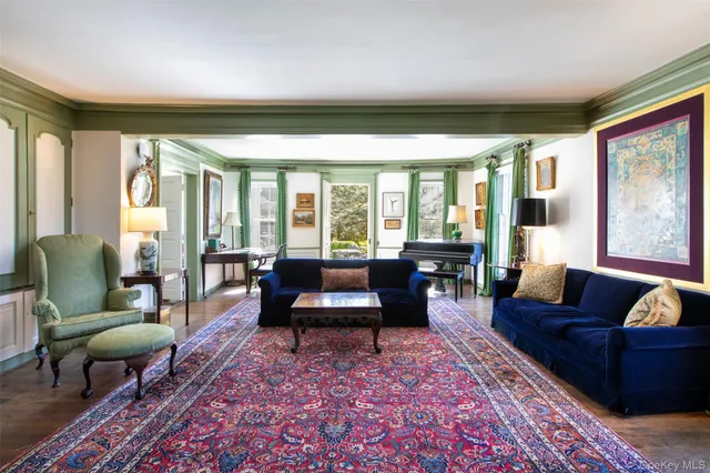 a living room with furniture and a lamp