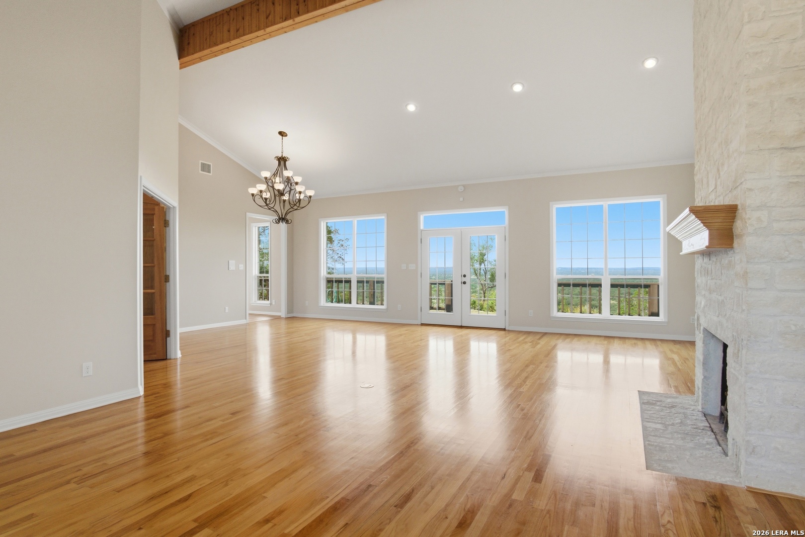 26 Seewald Road Boerne, TX 78006 - Photo 6 of 33 a view of an empty room with wooden floor and a window