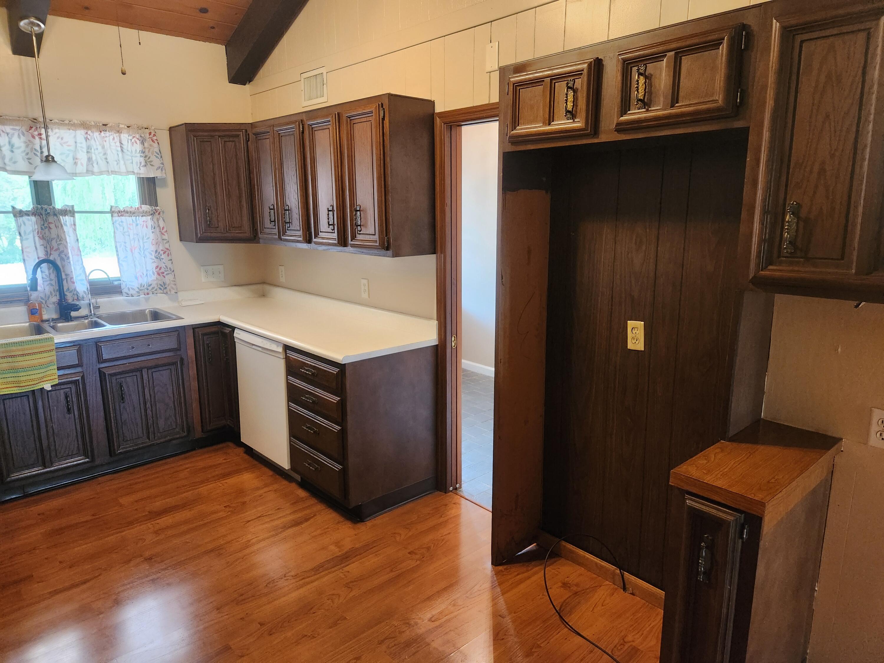 4726 Locksley Drive East Rensselaer, IN 47978 - Photo 6 of 33 a kitchen with stainless steel appliances granite countertop a refrigerator and a sink