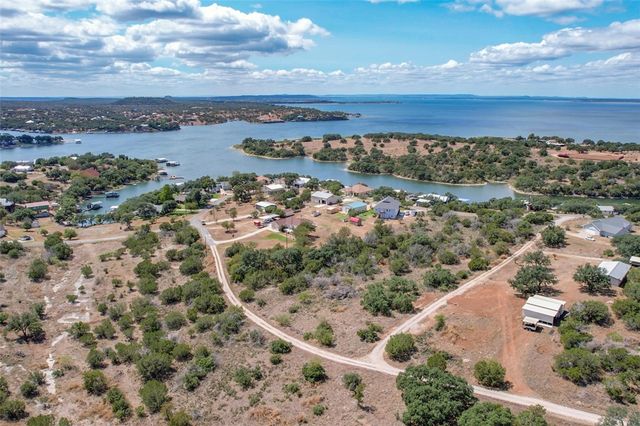 an aerial view of residential building and lake