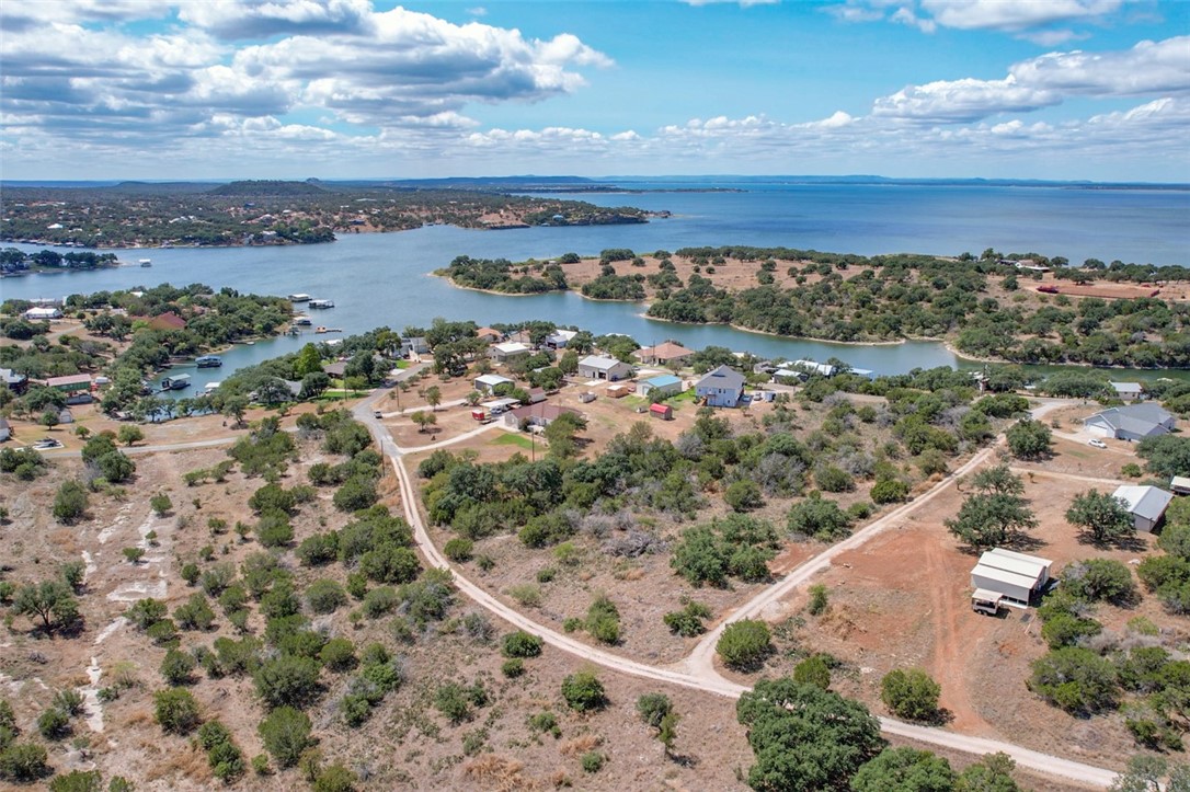 an aerial view of residential building and lake