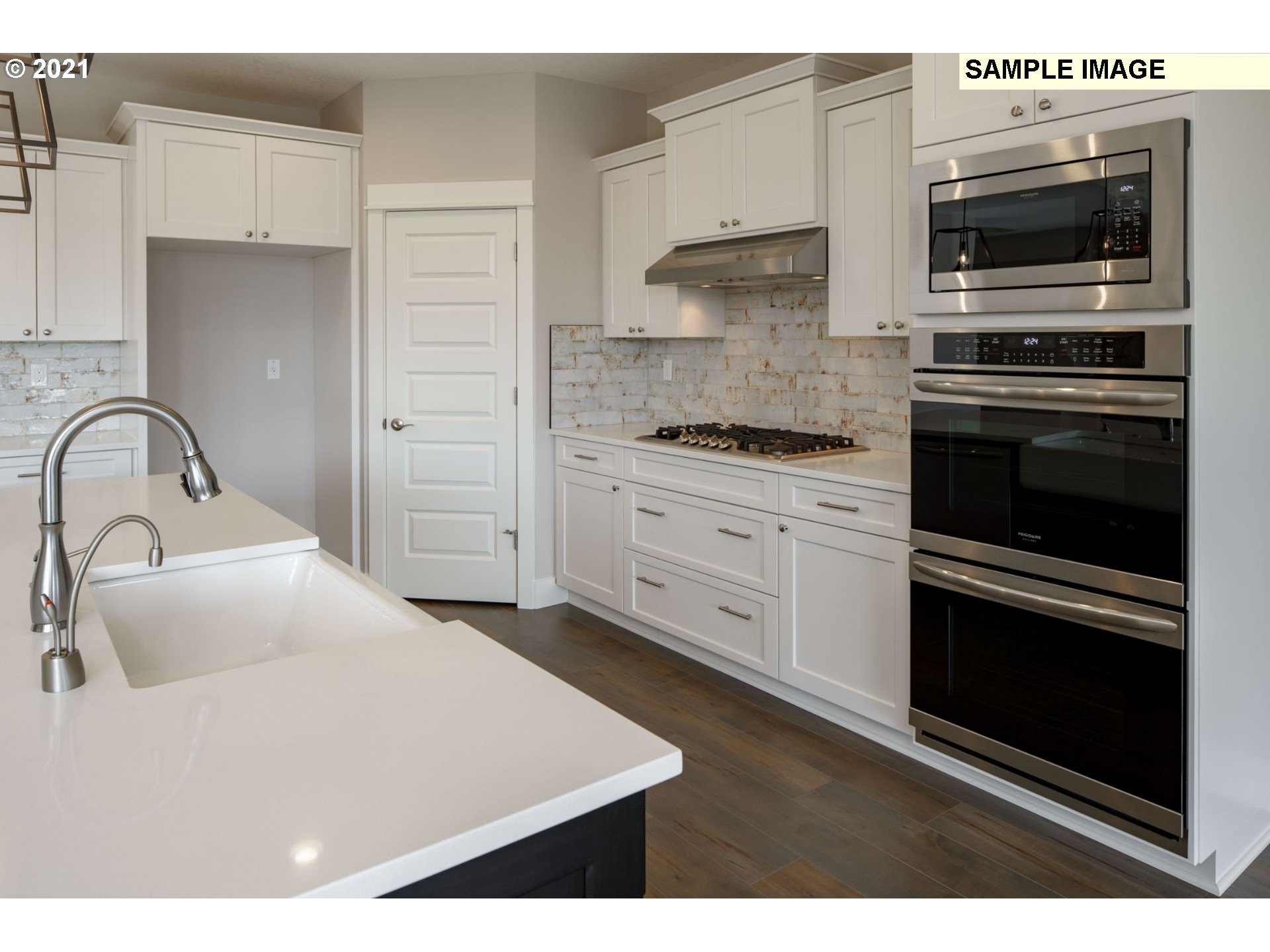 South Harper Valley Way Ridgefield, WA 98642 - Photo 10 of 24 a kitchen with a sink stove and cabinets