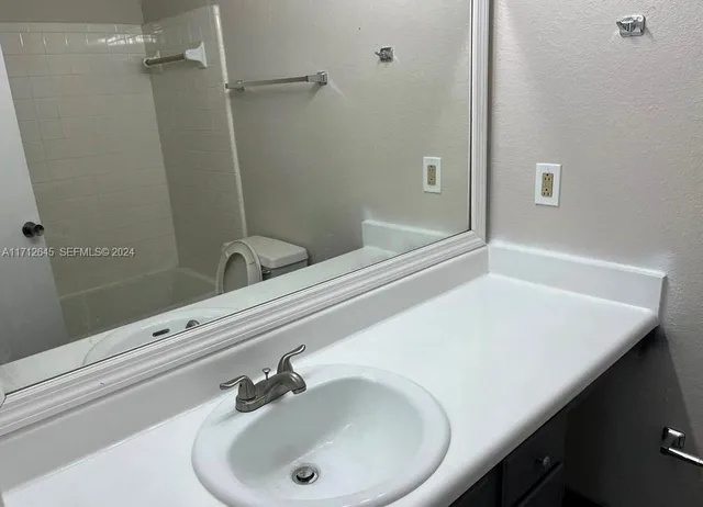 a bathroom with a sink and a bathtub