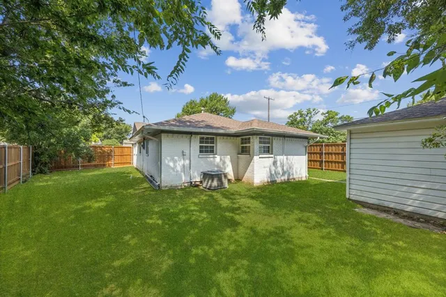 a backyard of a house with lots of green space