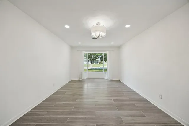 a kitchen with cabinets appliances and a sink