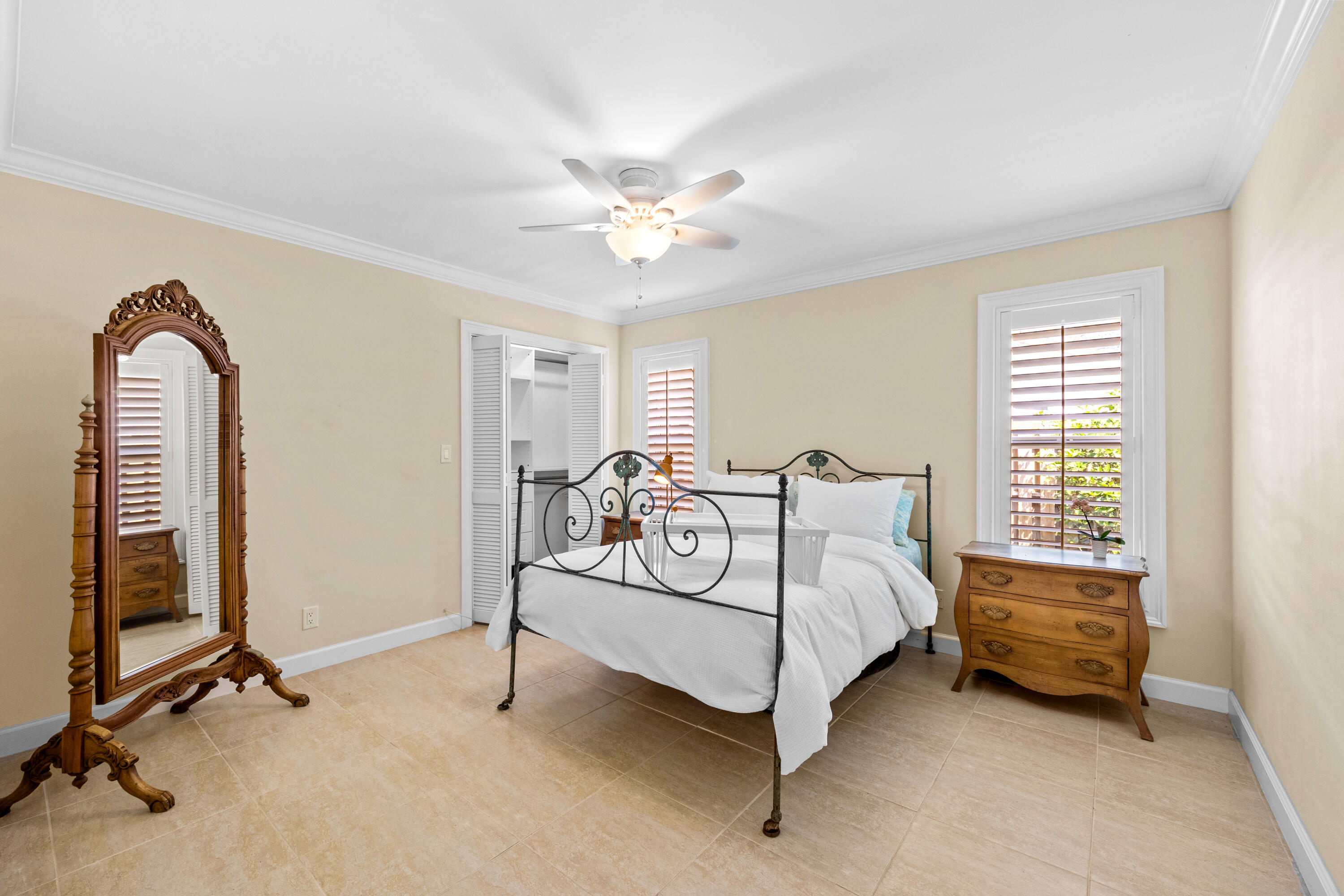 2136 Southwest 8th Avenue Boca Raton, FL 33486 - Photo 12 of 23 a bedroom with a bed and a chandelier