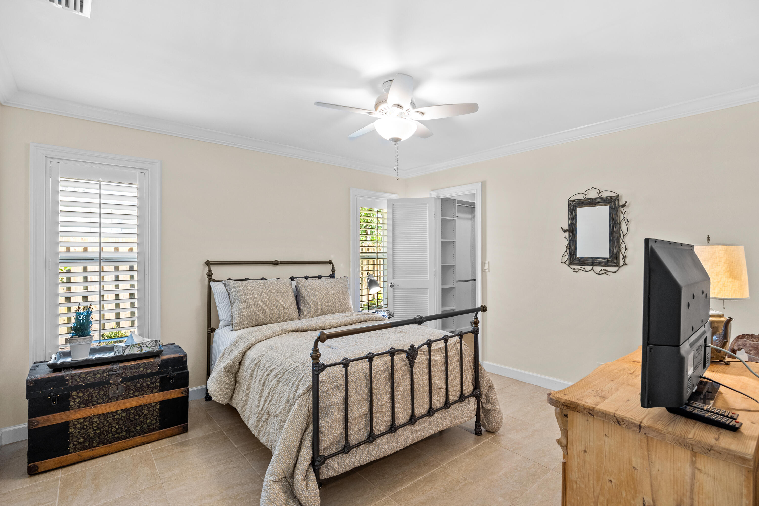 2136 Southwest 8th Avenue Boca Raton, FL 33486 - Photo 14 of 23 a bedroom with a bed and a tv