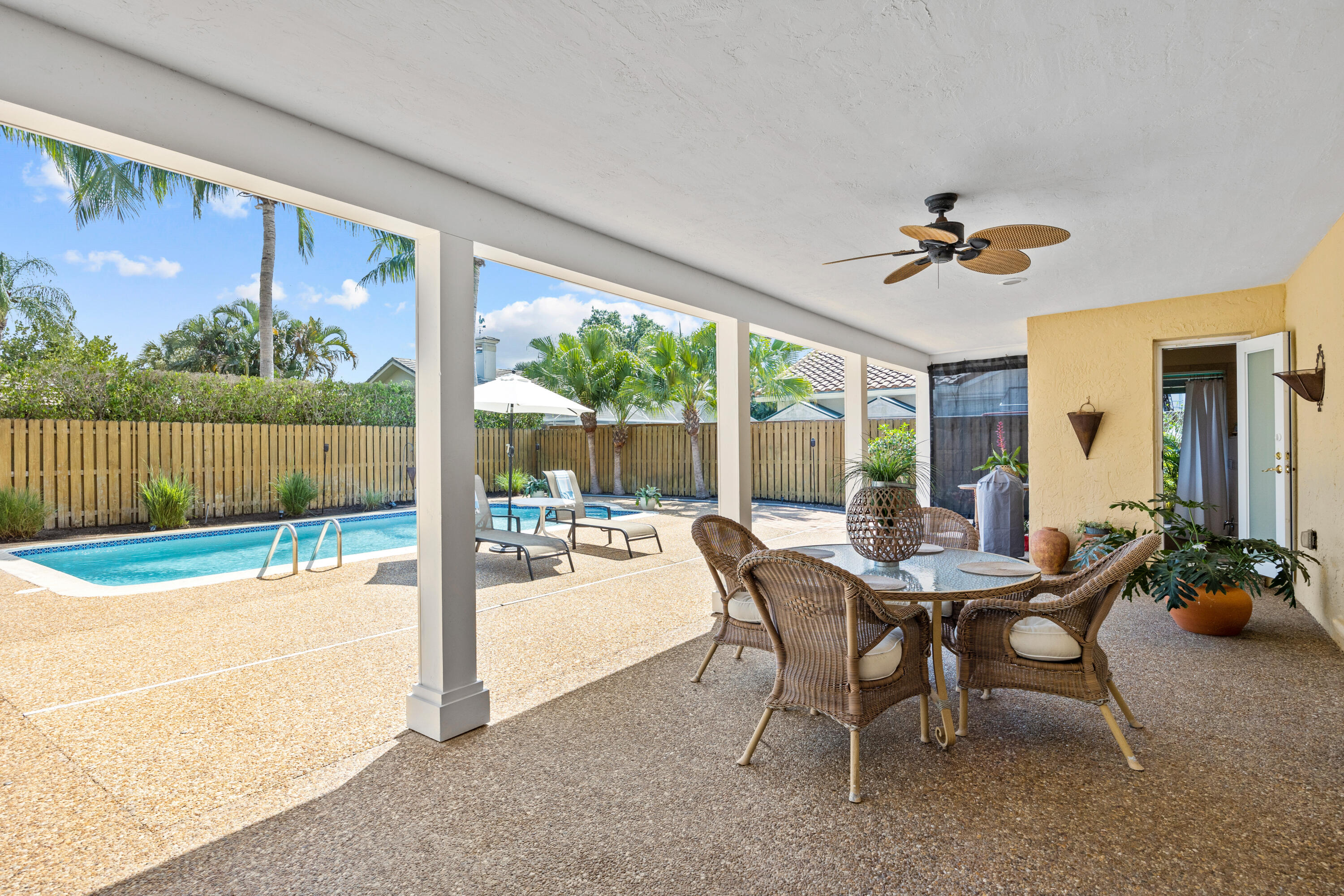 2136 Southwest 8th Avenue Boca Raton, FL 33486 - Photo 23 of 23 a view of a dining room with furniture large windows and wooden floor