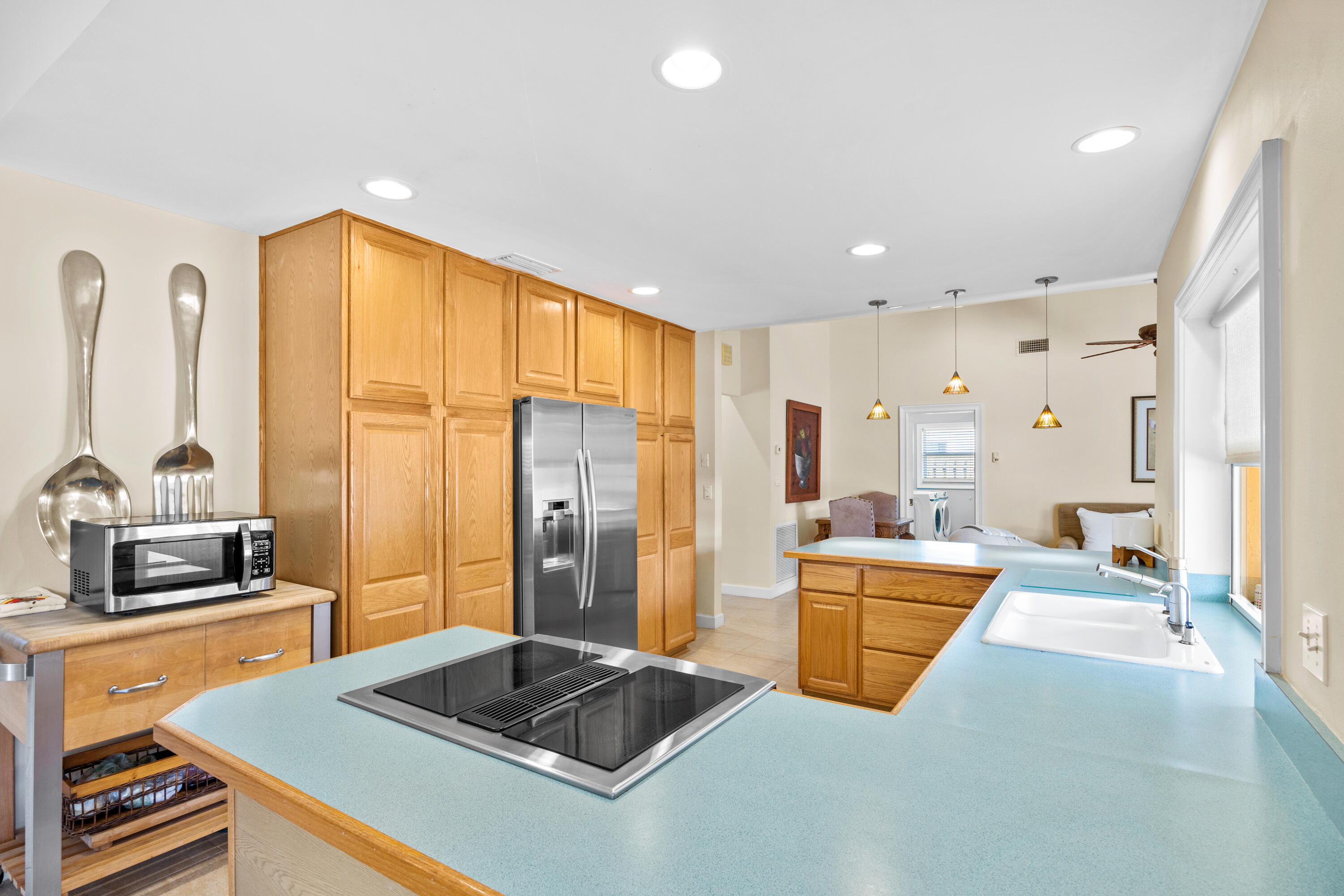 2136 Southwest 8th Avenue Boca Raton, FL 33486 - Photo 6 of 23 a kitchen with stainless steel appliances granite countertop a sink stove and refrigerator