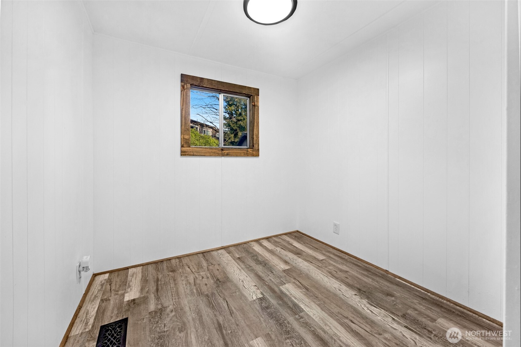14322 Admiralty Way, Unit 8 Lynnwood, WA 98087 - Photo 11 of 21 a view of a room with rack on the wall