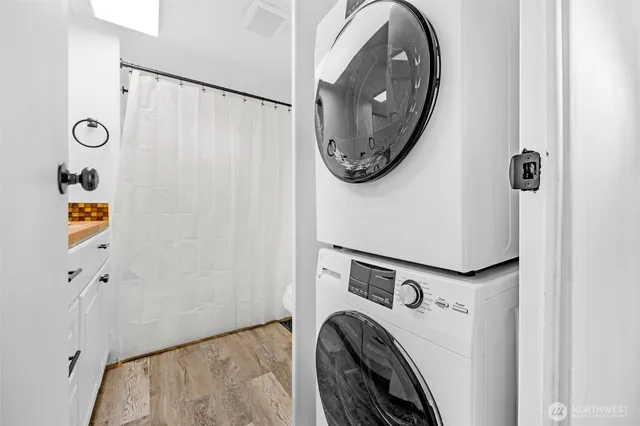 a view of livingroom with washer and dryer