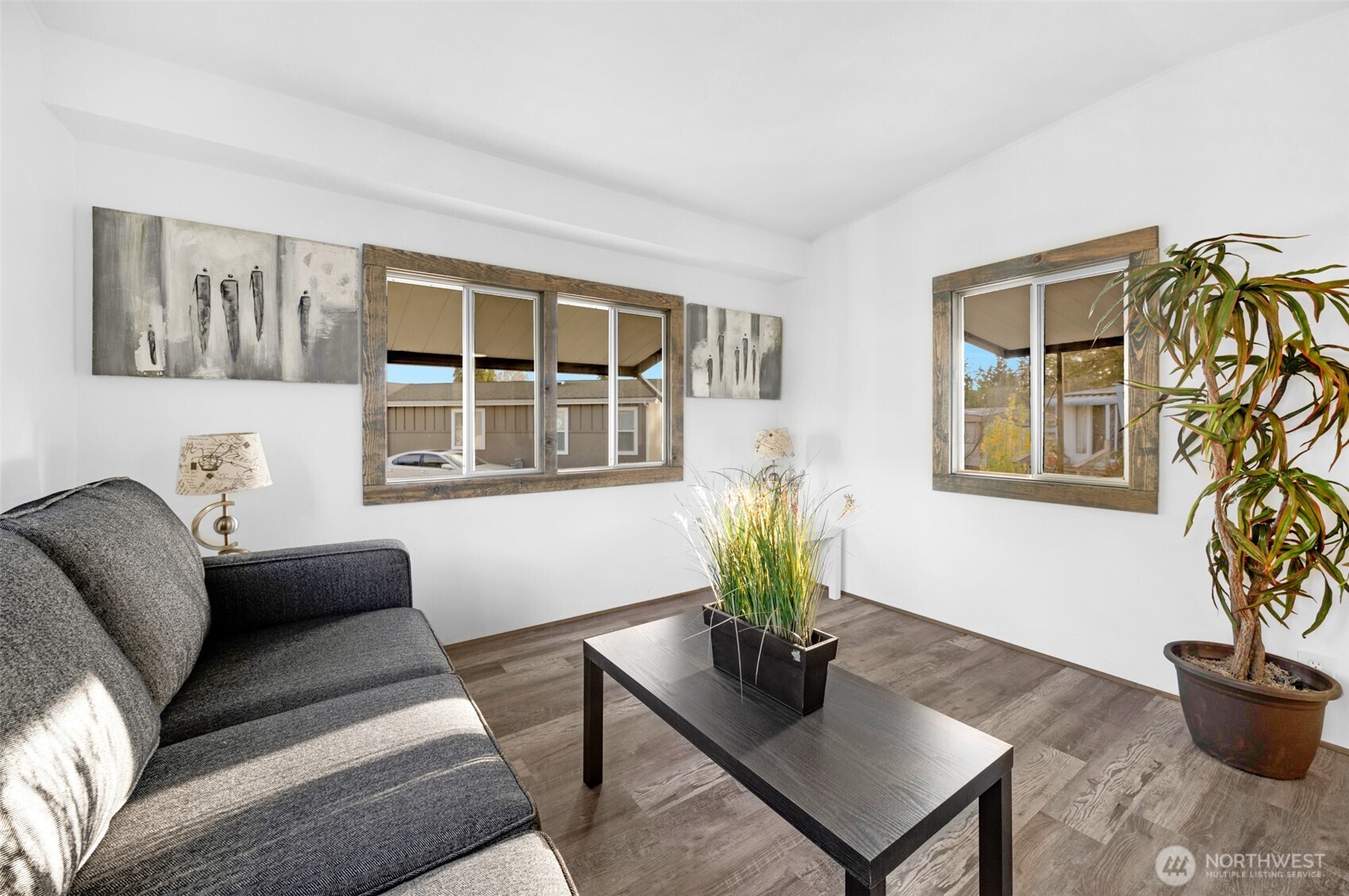 14322 Admiralty Way, Unit 8 Lynnwood, WA 98087 - Photo 8 of 21 a living room with furniture and a potted plant
