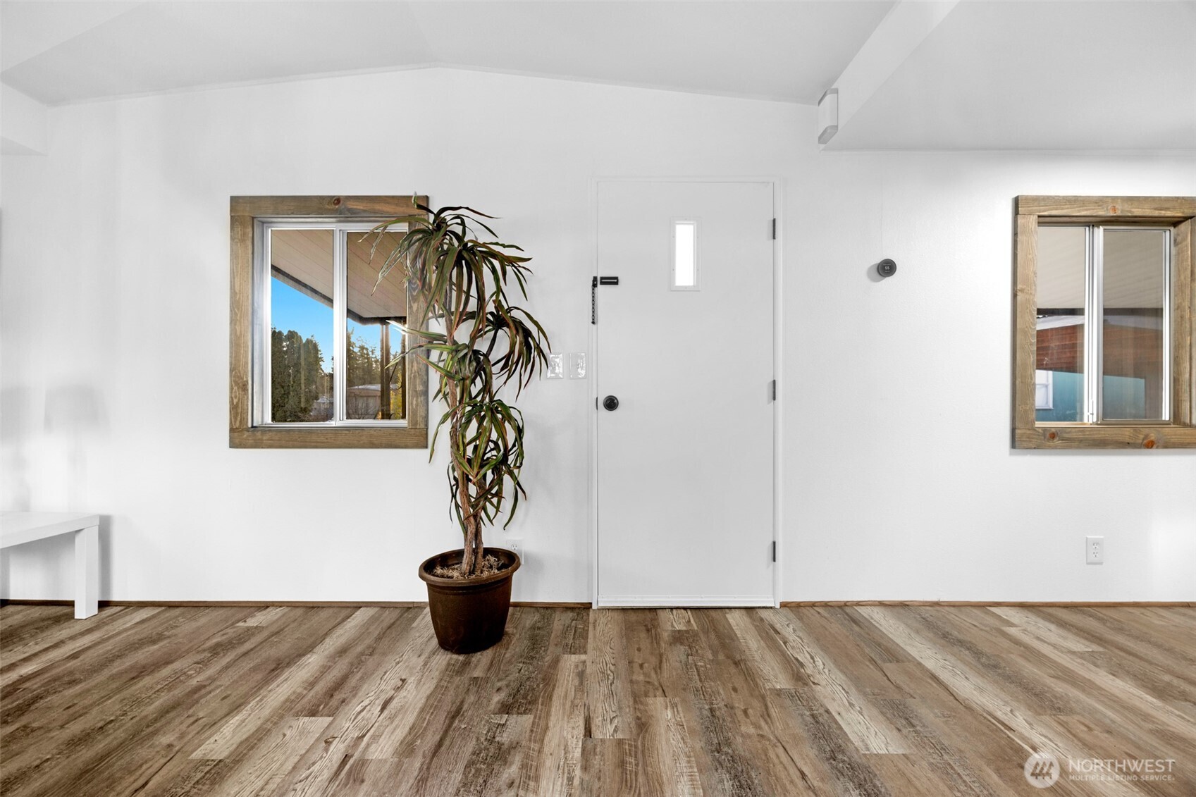 14322 Admiralty Way, Unit 8 Lynnwood, WA 98087 - Photo 10 of 21 a bedroom with a bed and a window