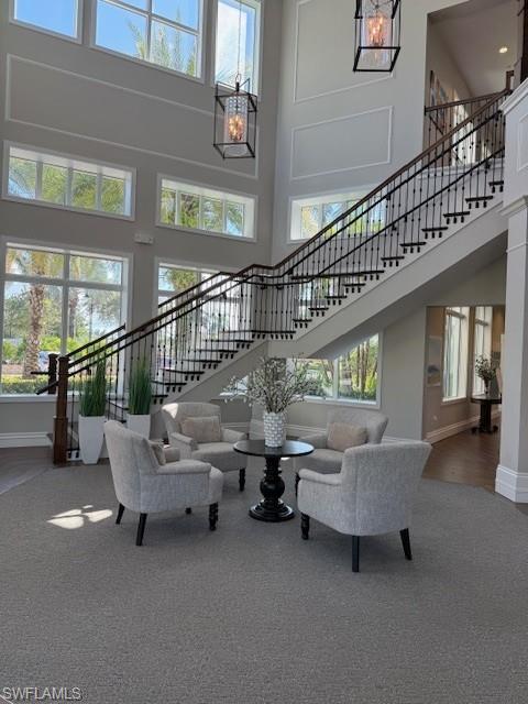 10787 Manatee Key Lane Estero, FL 33928 - Photo 30 of 31 a living room with furniture and a chandelier
