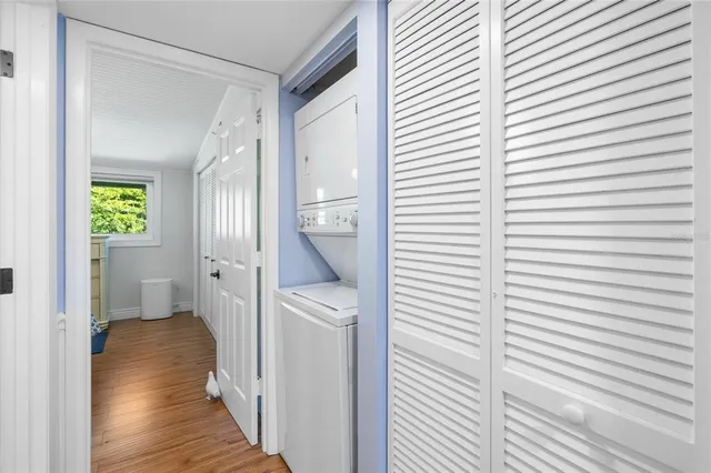 a view of hallway with wooden floor