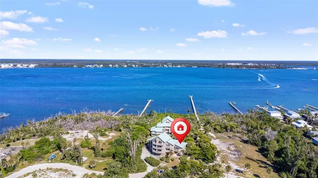 a view of a room with table & chairs