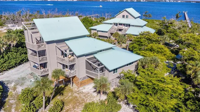 an aerial view of a house with a yard and garden