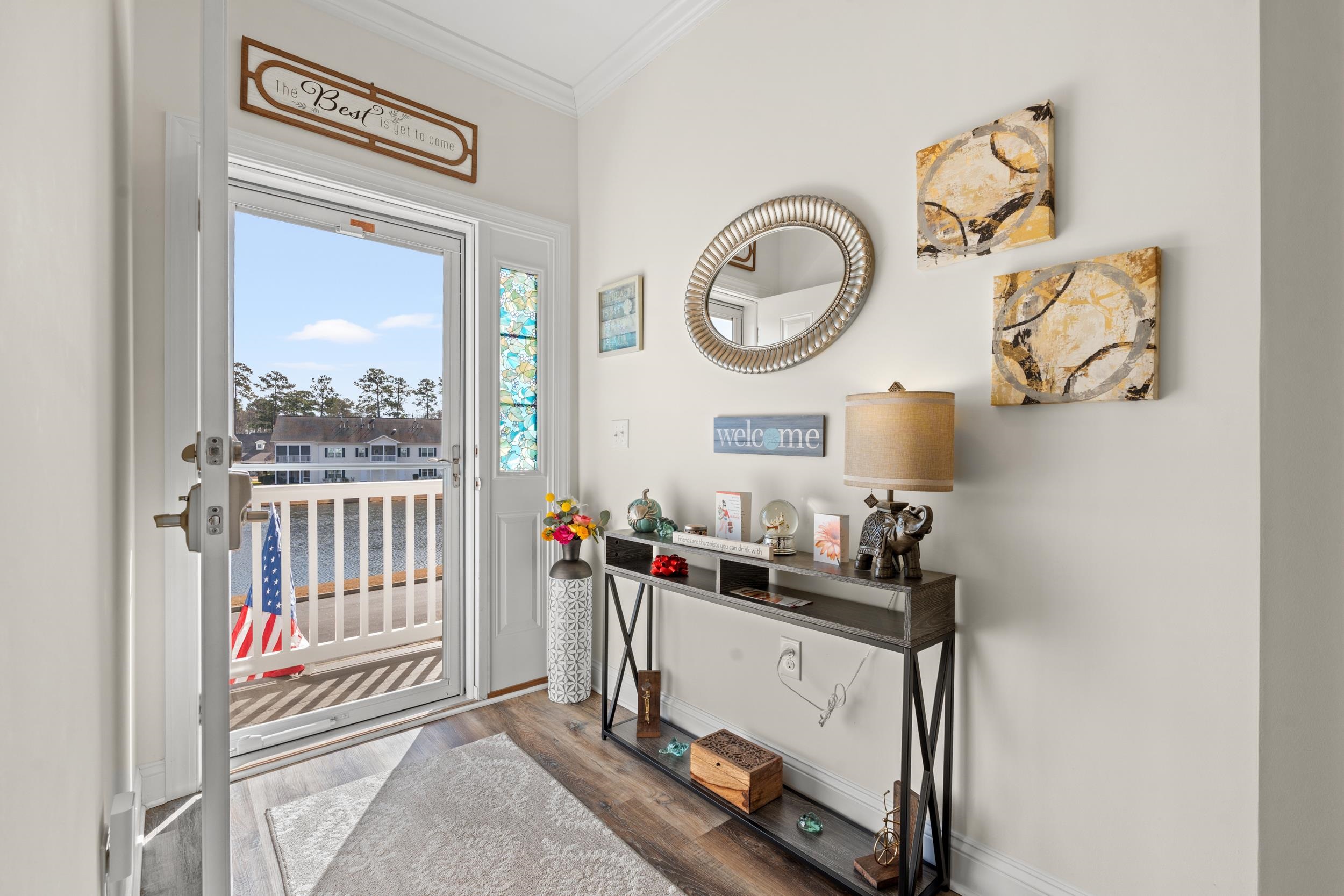 900 Jackline Place, Unit 202 Columbia, SC 29209 - Photo 2 of 39 Doorway to outside featuring wood finished floors and crown molding