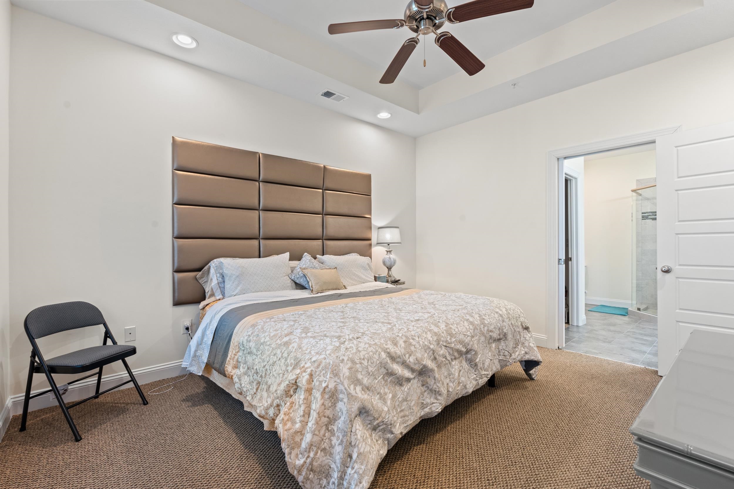 900 Jackline Place, Unit 202 Columbia, SC 29209 - Photo 25 of 39 Bedroom featuring carpet flooring, ensuite bathroom, a tray ceiling, a ceiling fan, and recessed lighting