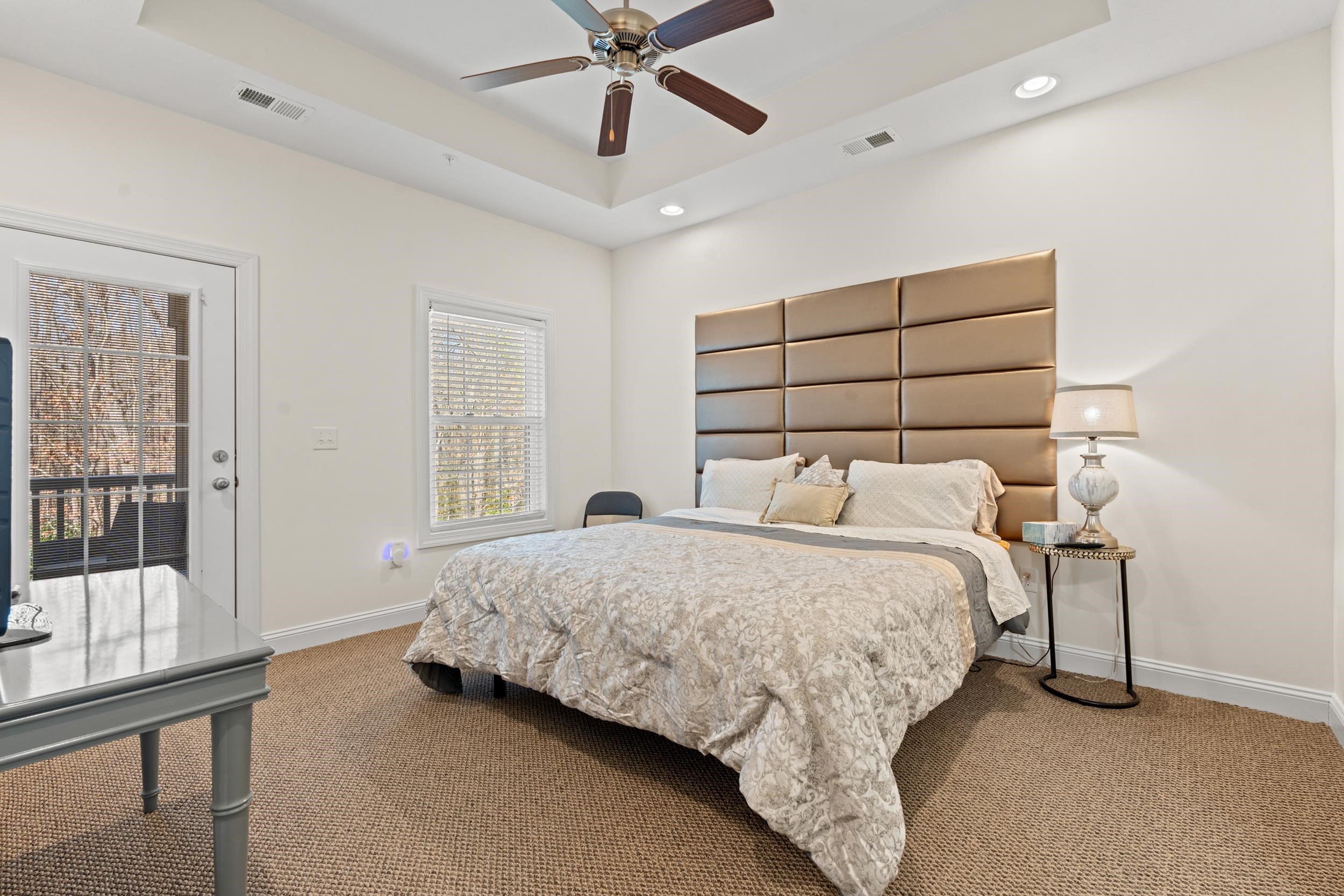 900 Jackline Place, Unit 202 Columbia, SC 29209 - Photo 7 of 39 Bedroom featuring a tray ceiling, carpet floors, a ceiling fan, access to outside, and recessed lighting