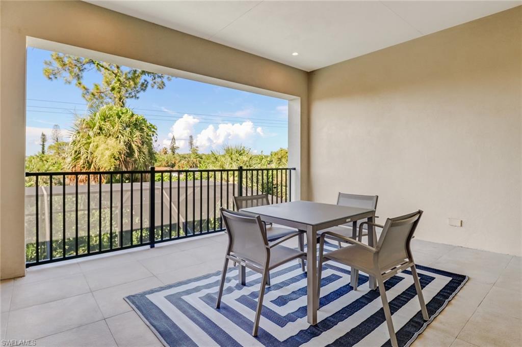 2875 Coco Lakes Drive Naples, FL 34105 - Photo 20 of 27 a view of a chairs in wooden floor