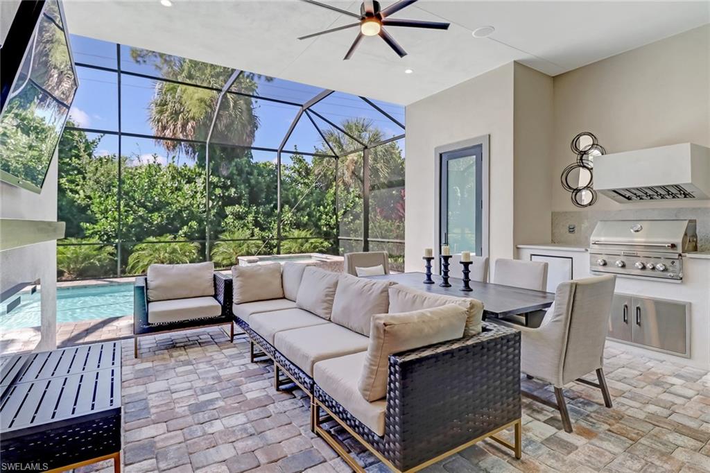 2875 Coco Lakes Drive Naples, FL 34105 - Photo 22 of 27 a view of a patio with couches and potted plants
