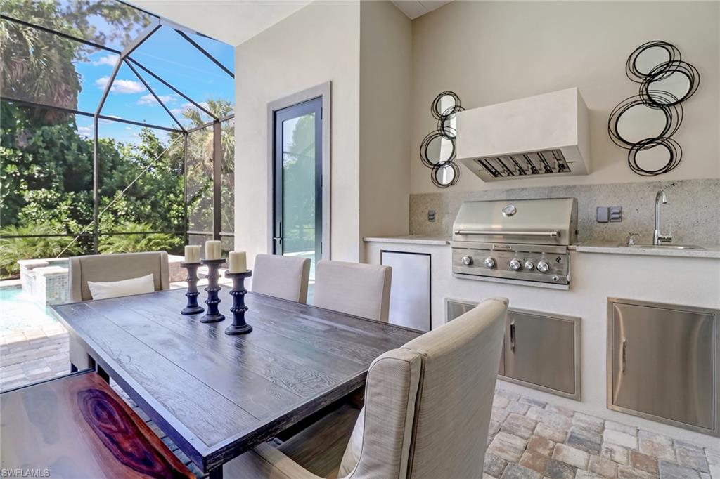 2875 Coco Lakes Drive Naples, FL 34105 - Photo 23 of 27 a dining room with furniture and window
