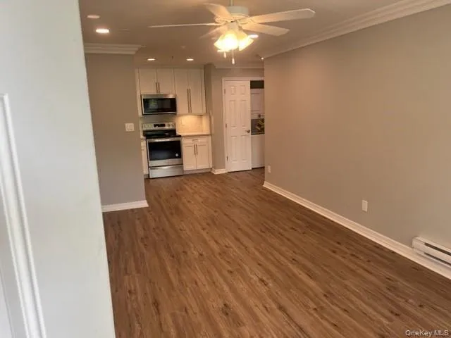 a view of a kitchen from the hallway