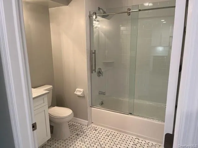 a bathroom with a shower and a toilet