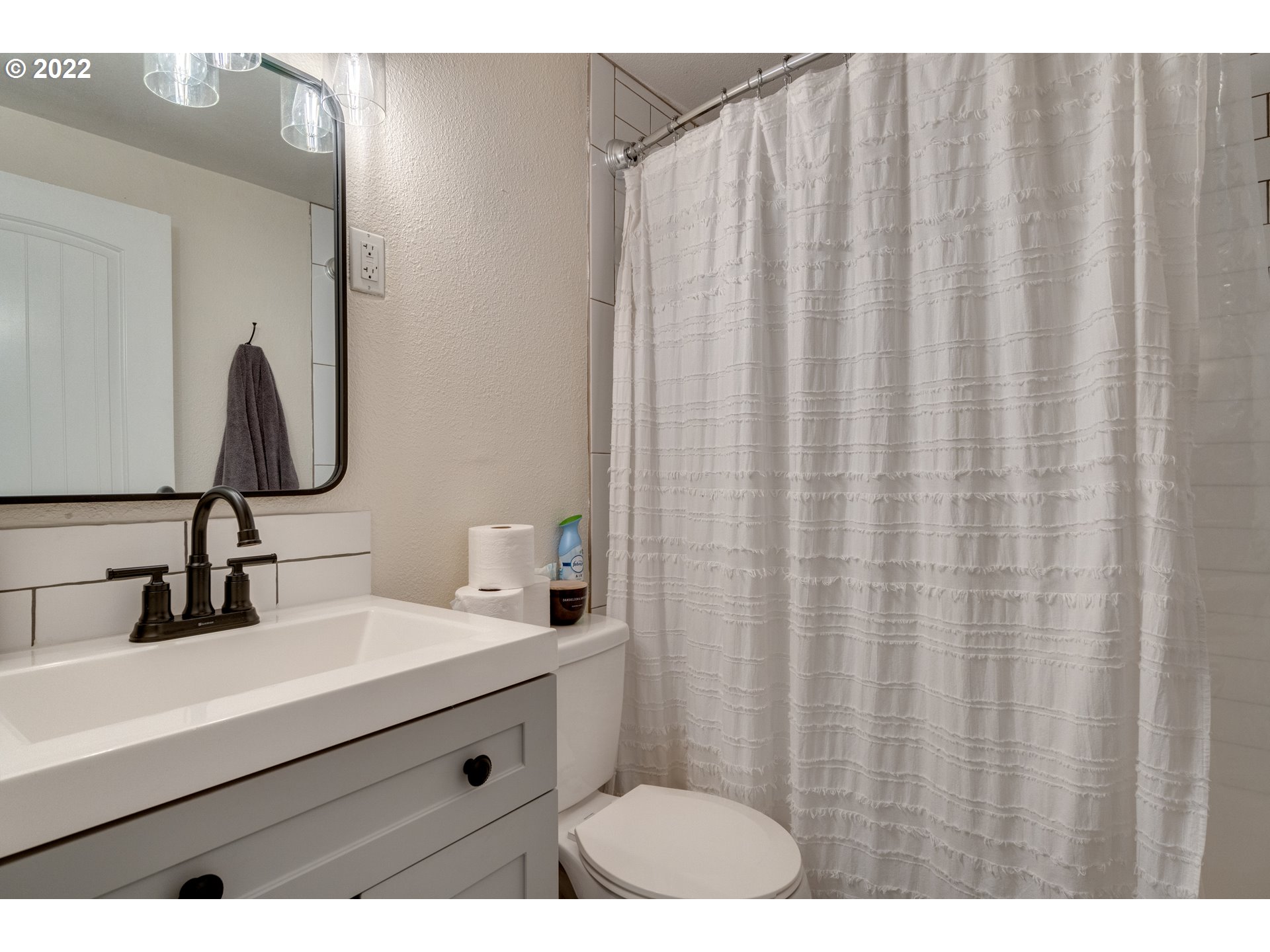 3405 Northeast Corbin Road Vancouver, WA 98686 - Photo 22 of 30 a bathroom with a sink and a mirror