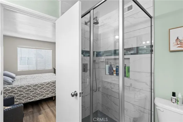 a bathroom with a bathtub and shower