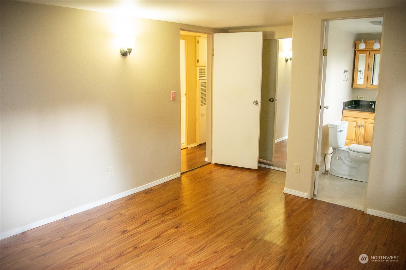 7701 Hardeson Road, Unit 2 Everett, WA 98203 - Photo 14 of 25 an empty room with wooden floor and a window