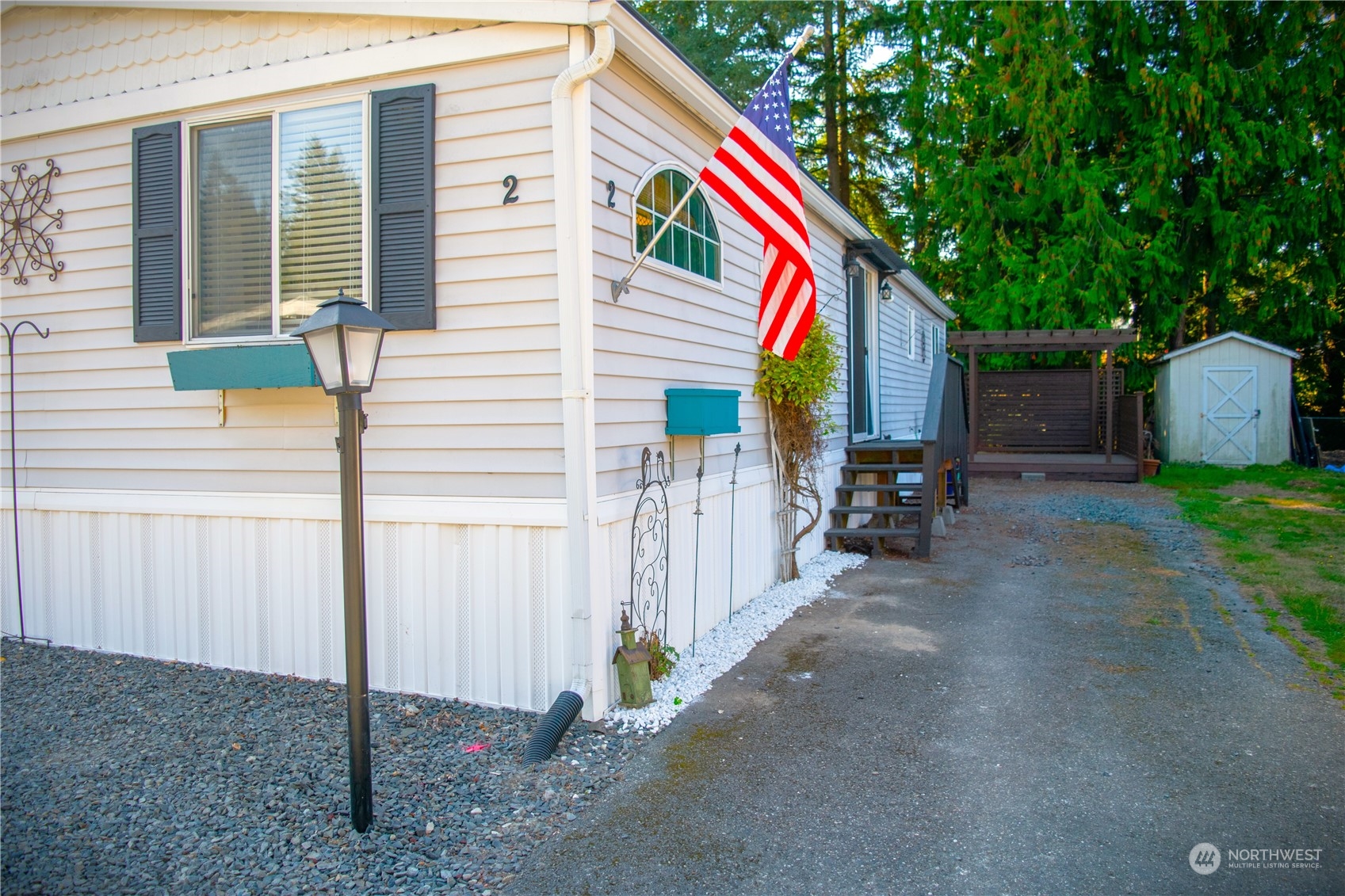 7701 Hardeson Road, Unit 2 Everett, WA 98203 - Photo 23 of 25 a view of small house with backyard