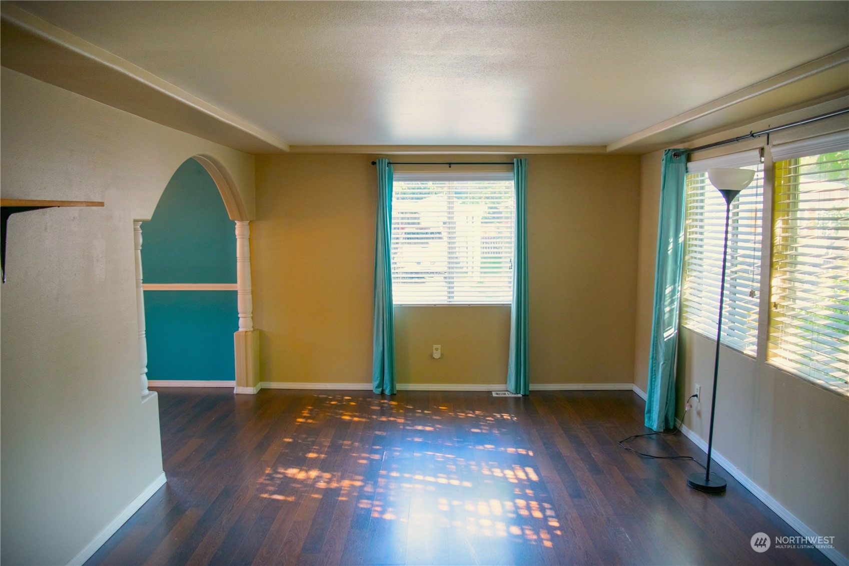 7701 Hardeson Road, Unit 2 Everett, WA 98203 - Photo 5 of 25 an empty room with wooden floor and windows