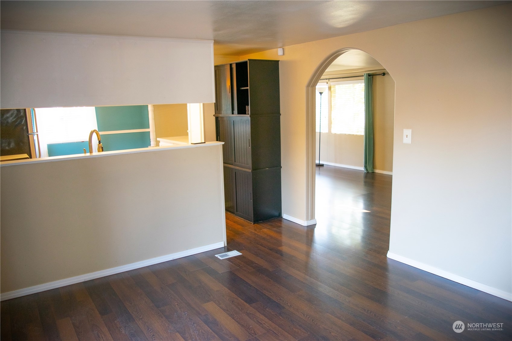 7701 Hardeson Road, Unit 2 Everett, WA 98203 - Photo 6 of 25 an empty room with wooden floor and a window