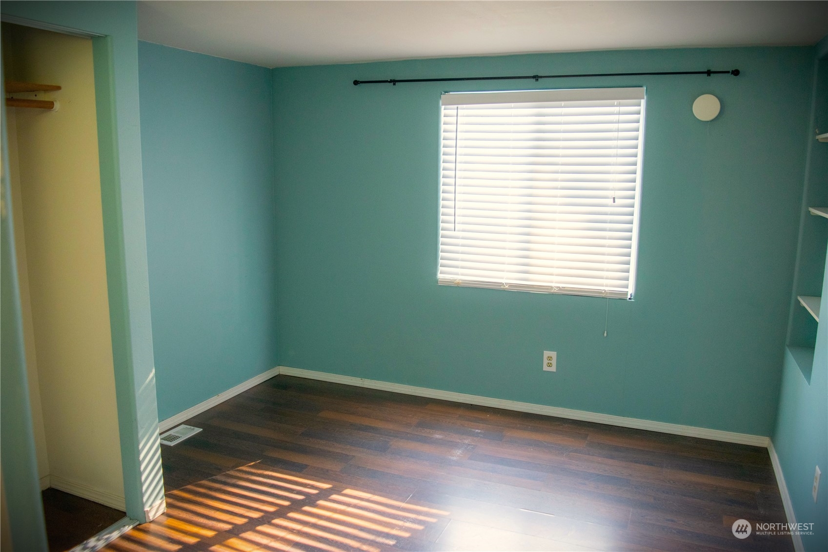 7701 Hardeson Road, Unit 2 Everett, WA 98203 - Photo 8 of 25 a room with window and wooden floor