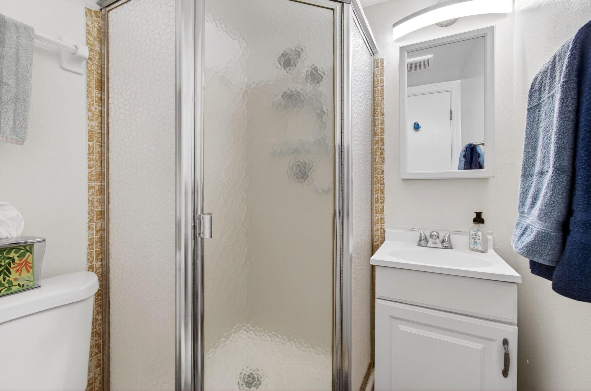 600 Southwest 2nd Avenue, Unit 240 Boca Raton, FL 33432 - Photo 20 of 54 a bathroom with a sink a toilet and a mirror