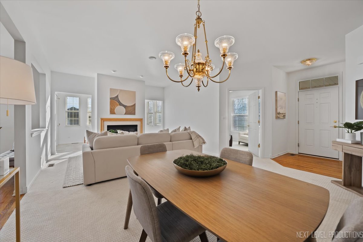 810 Cambridge Drive Batavia, IL 60510 - Photo 12 of 34 a view of a dining room with furniture and chandelier