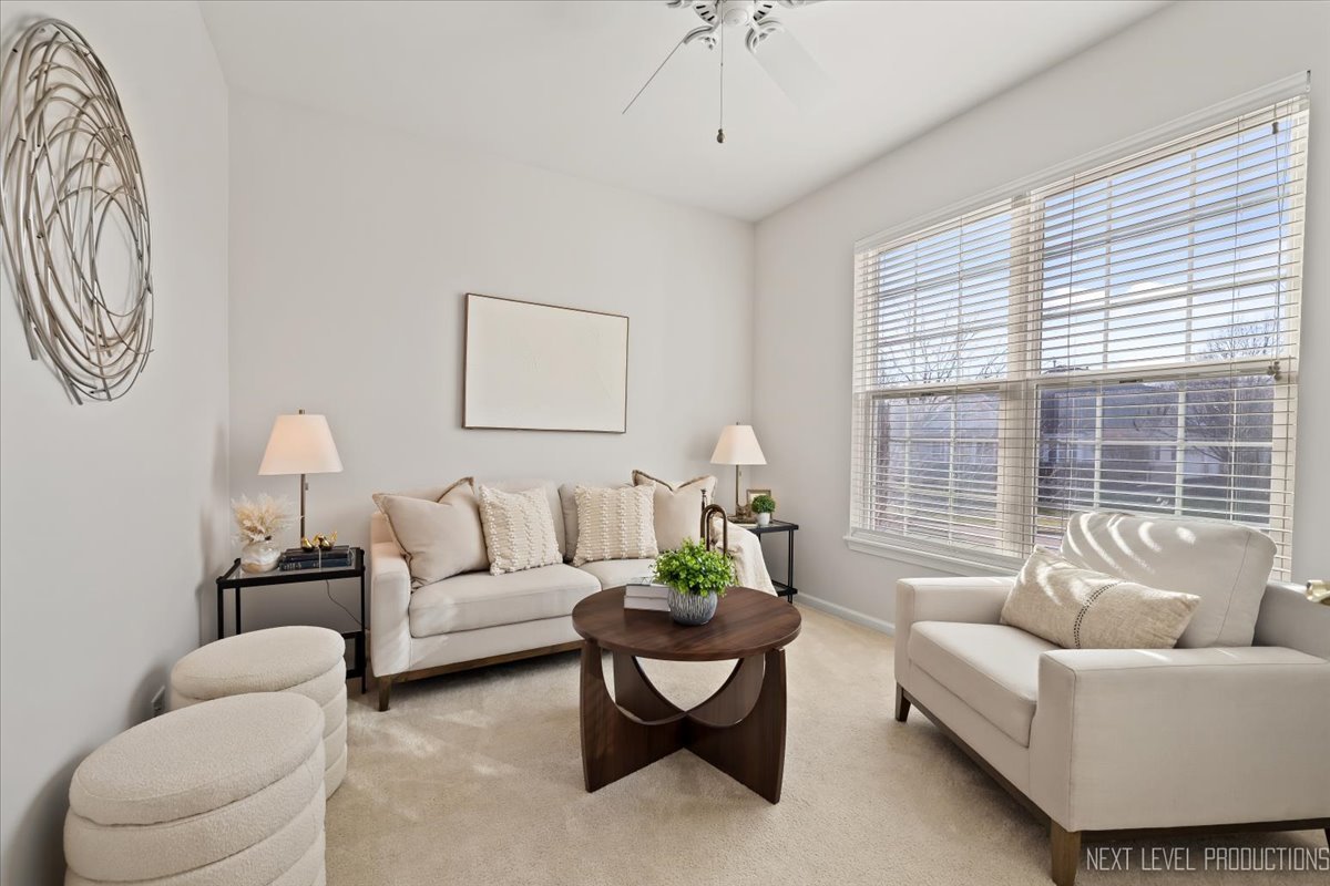 810 Cambridge Drive Batavia, IL 60510 - Photo 14 of 34 a living room with furniture and a large window