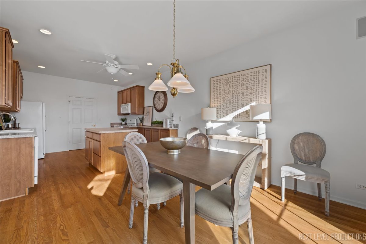 810 Cambridge Drive Batavia, IL 60510 - Photo 15 of 34 a view of a dining room with furniture and wooden floor