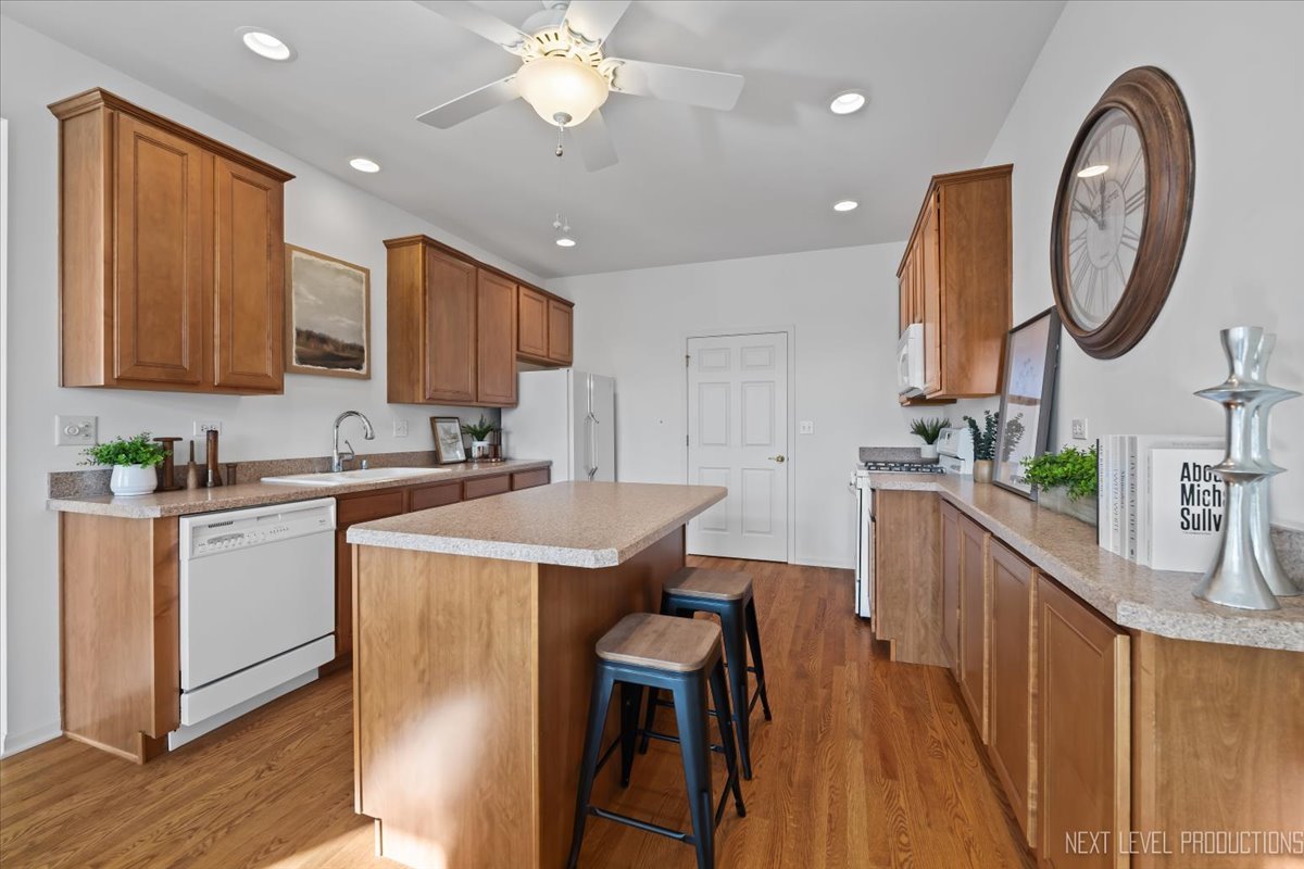 810 Cambridge Drive Batavia, IL 60510 - Photo 17 of 34 a kitchen with a table chairs sink and cabinets