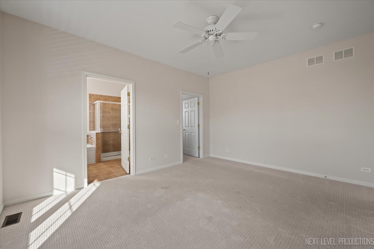 810 Cambridge Drive Batavia, IL 60510 - Photo 22 of 34 a view of an empty room with a window