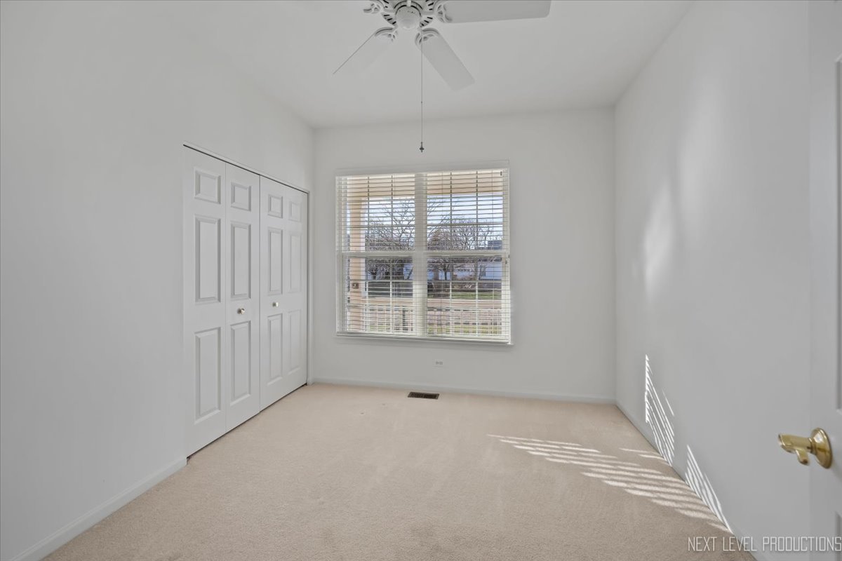 810 Cambridge Drive Batavia, IL 60510 - Photo 27 of 34 a view of an empty room with a window