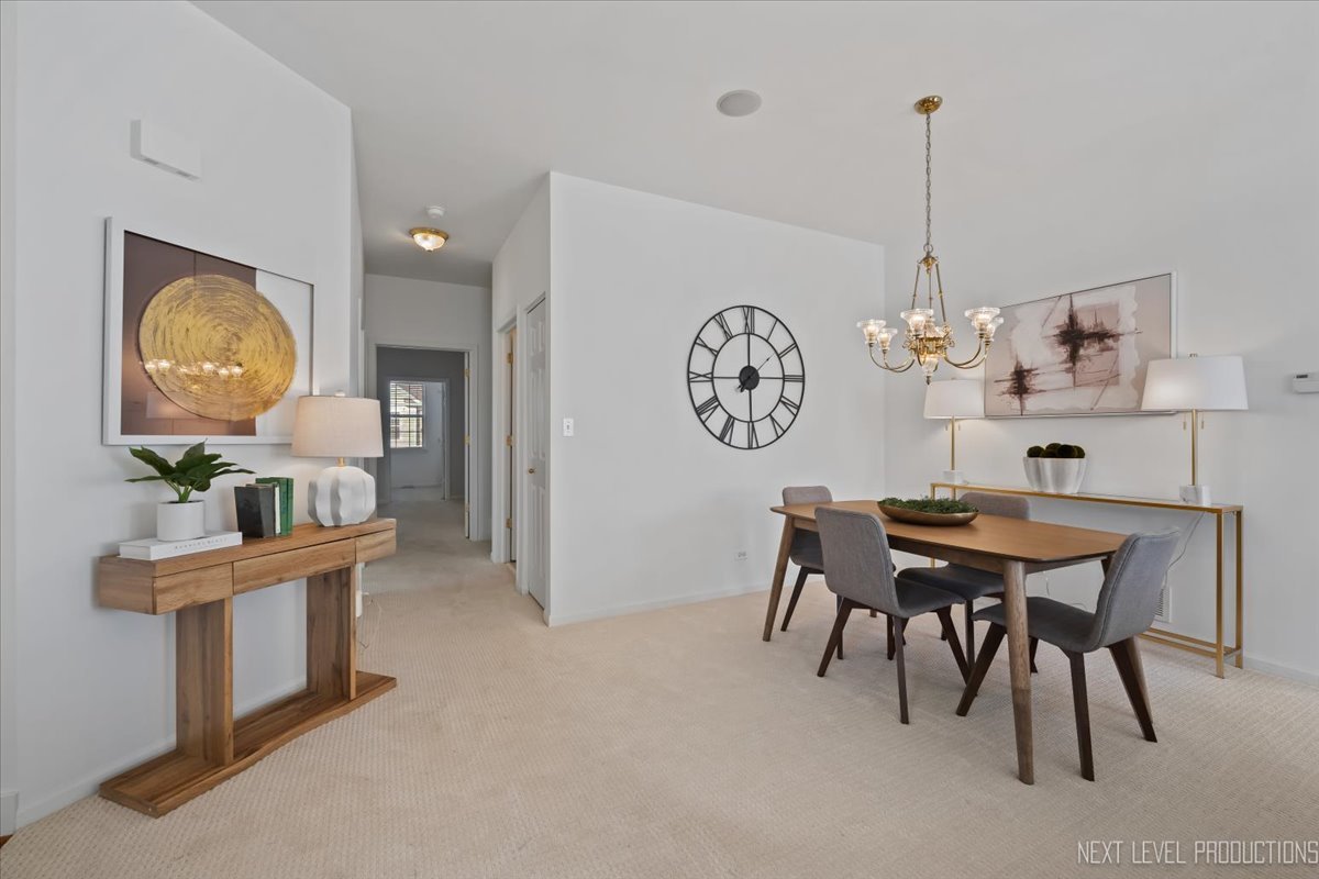 810 Cambridge Drive Batavia, IL 60510 - Photo 5 of 34 a view of a dining room with furniture and chandelier