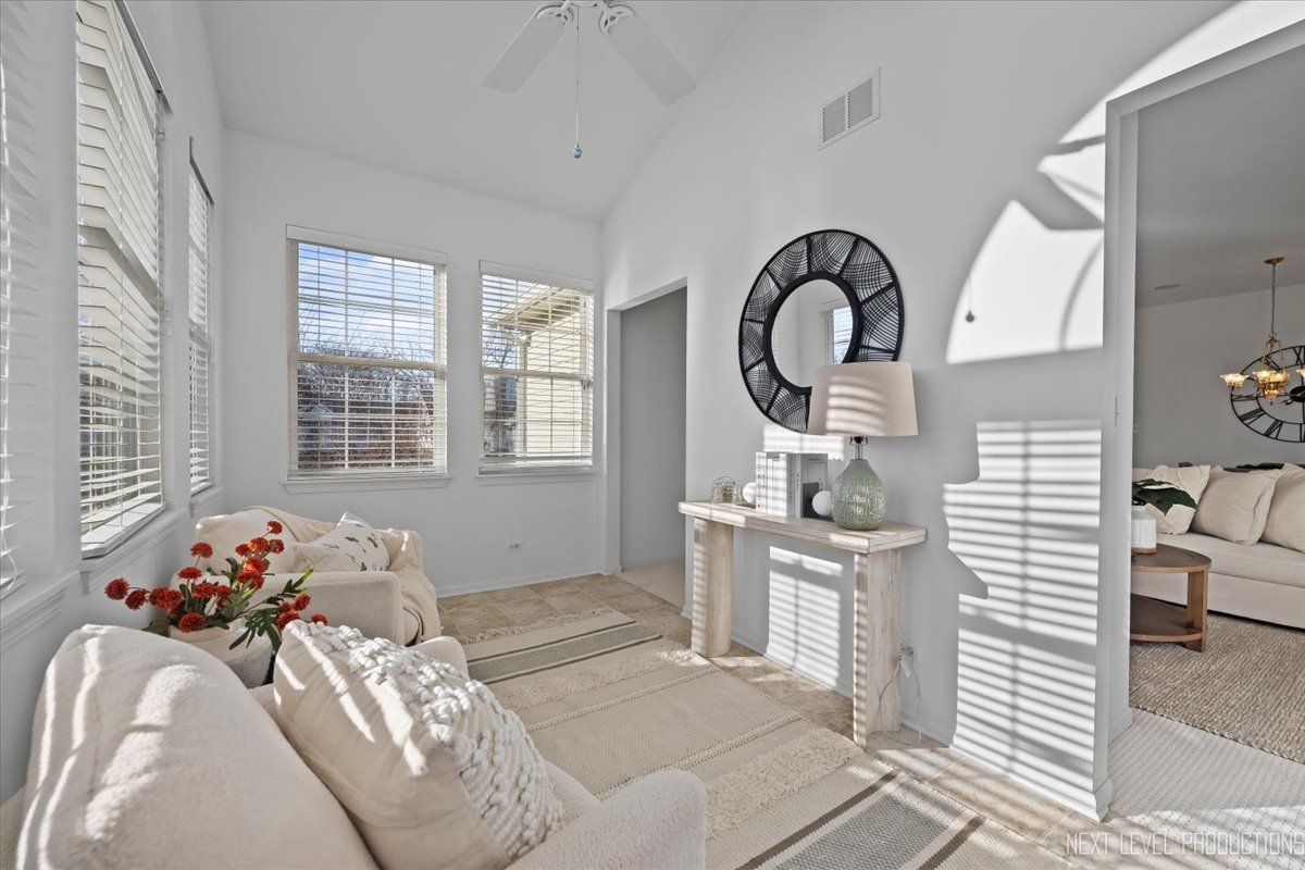 810 Cambridge Drive Batavia, IL 60510 - Photo 8 of 34 a bedroom with a bed and a large window